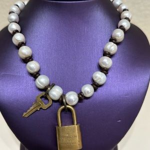 17” Pearl and leather necklace with Louis Vuitton lock and key.